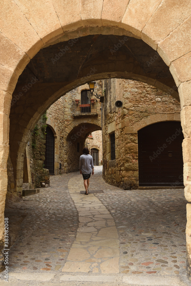 arch of main square old town of medieval village of Pals, Girona province, Catalonia, Spain