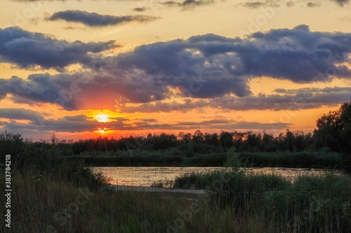  Bank of river on sunset