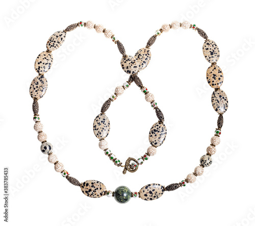 handmade necklace from aplite cabochons, glass beads, green serpentinite ball, cracked cacholong beads and brass inserts isolated on white background