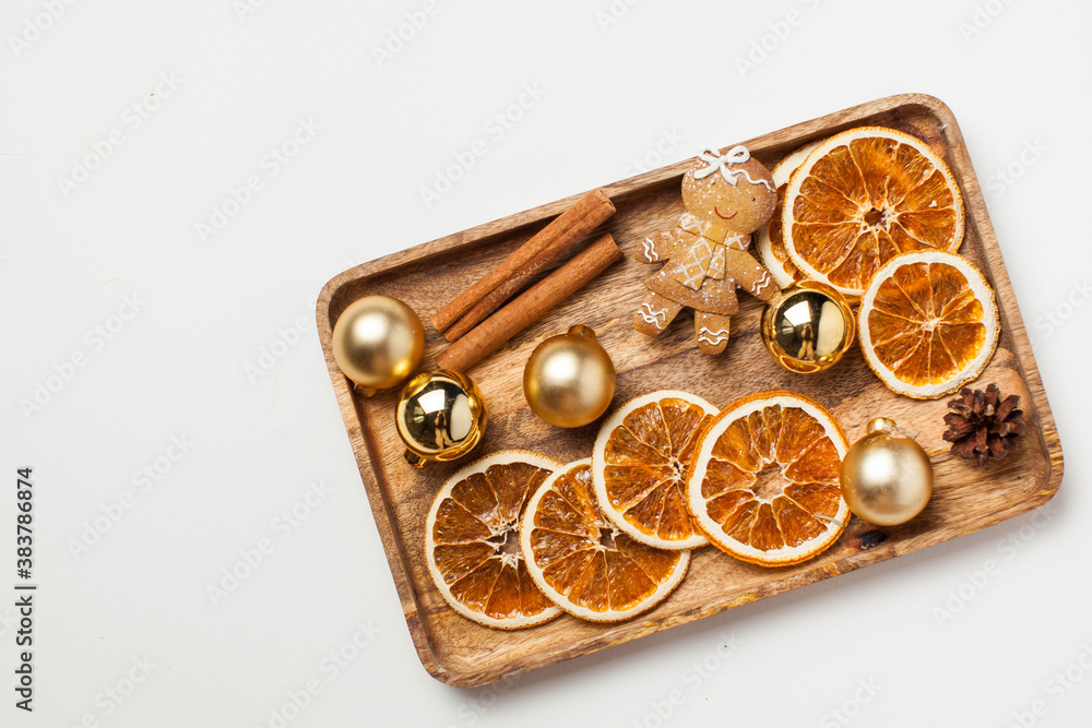 Christmas card with gingerbread man, cinnamon, dried orange slices and Christmas toys. Copy space. Christmas card with gingerbread man, cinnamon, dried orange slices and Christmas toys. Copy space.
