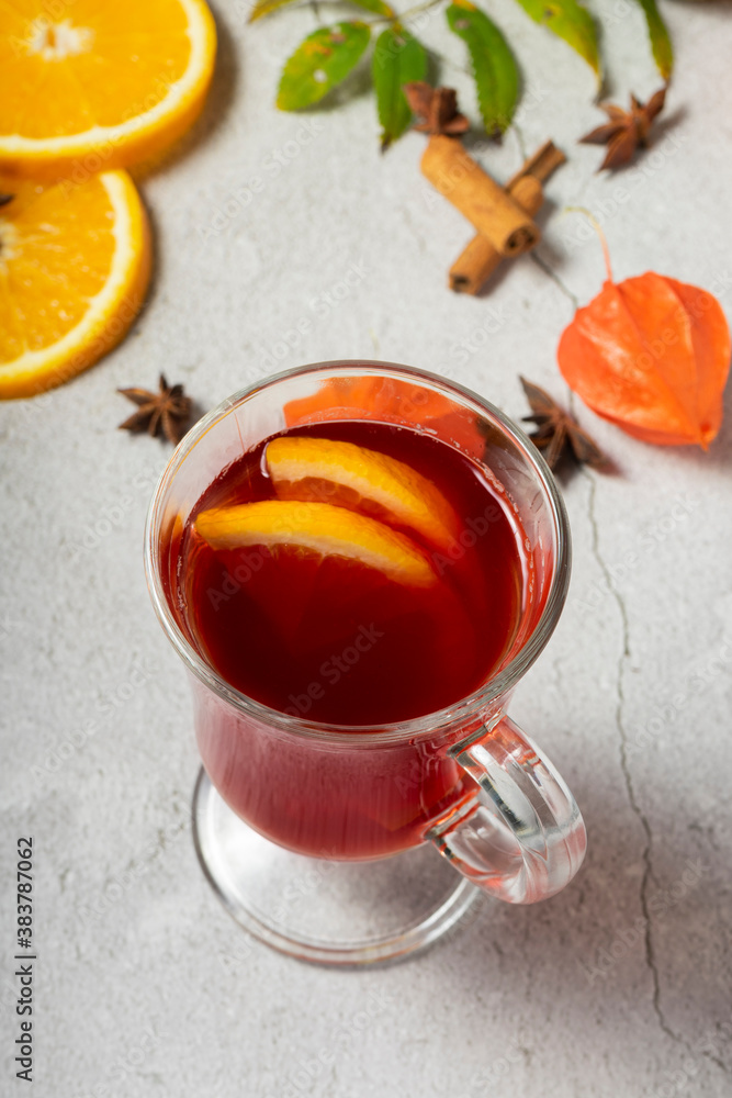 selective focus, hot drink, warmed red wine with fruit from oranges and apples, with spices of anise and cinnamon selective focus, hot drink, warmed red wine with fruit from oranges and apples, with spices of anise and cinnamon