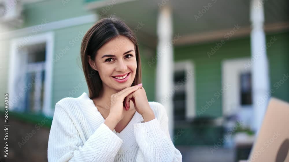 Feminine posing with laptop outdoor at rustic house. Medium close up shot on 4k RED camera Feminine posing with laptop outdoor at rustic house. Medium close up shot on 4k RED camera