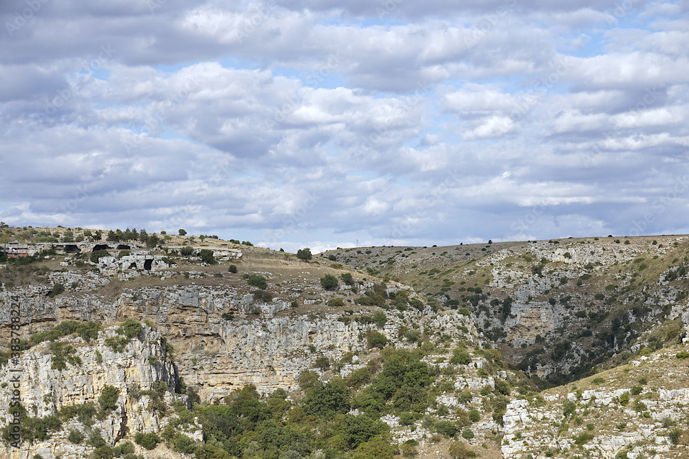 matera, a city to visit, admire, discover. a typical glimpse of the matera landscape - gravina canyon	