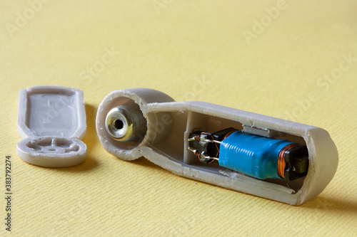 Photos Disassembled radio frequency anti-theft sensor in plastic housing