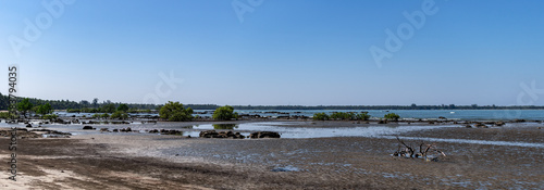 Panorama of coastline of a sand beach during low tide at Ngwesaung, Irrawaddy, Myanmar