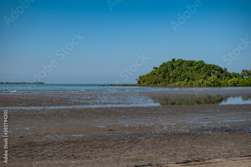 Coastline of a sand beach during low tide at Ngwesaung, Irrawaddy, Myanmar photo