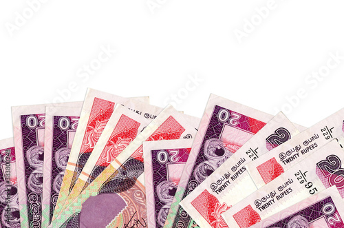 20 Sri Lankan rupees bills lies on bottom side of screen isolated on white background with copy space. Background banner template photo