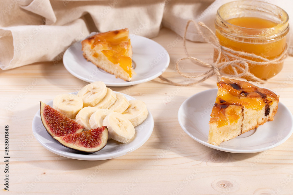 delicious banana and honey, apricot pie. selective focus. close up shot. wooden surface delicious banana and honey, apricot pie. selective focus. close up shot. wooden surface