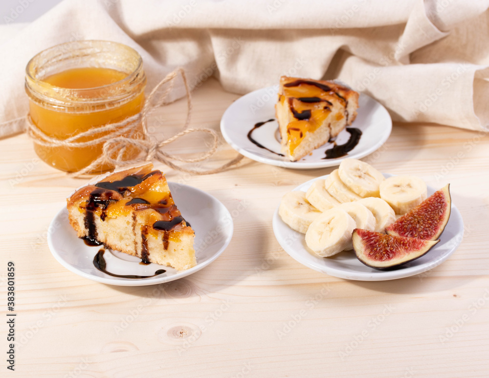delicious banana and honey, apricot pie. selective focus. close up shot. wooden surface delicious banana and honey, apricot pie. selective focus. close up shot. wooden surface