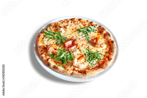 White plate with round pizza and shrimp.