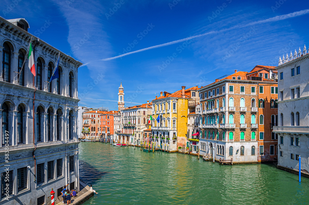 Obraz premium Grand Canal waterway in Venice historical city centre with Palazzo Civran palace, Venetian colorful buildings and Church of the Holy Apostles of Christ bell tower. Veneto Region, Northern Italy.