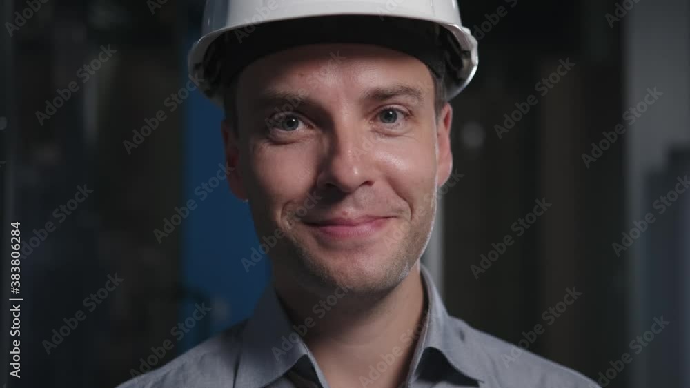 Portrait professional engineer in a shirt and a construction helmet Portrait professional engineer in a shirt and a construction helmet
