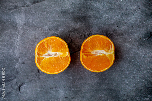 orange slices on a gray background © VikaEmerson