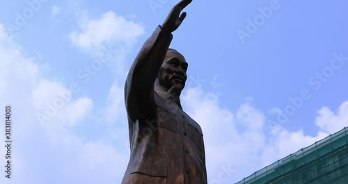 A statue of Ho Chi Minh at Guyen hue street in Ho Chi Minh City handheld photo