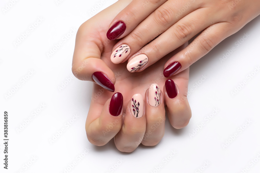 Gel burgundy, peach manicure with leaves on long oval nails close-up on a  white background. Autumn manicure. Stock Photo | Adobe Stock