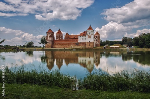 Castle with mirror reflection in the water of lake