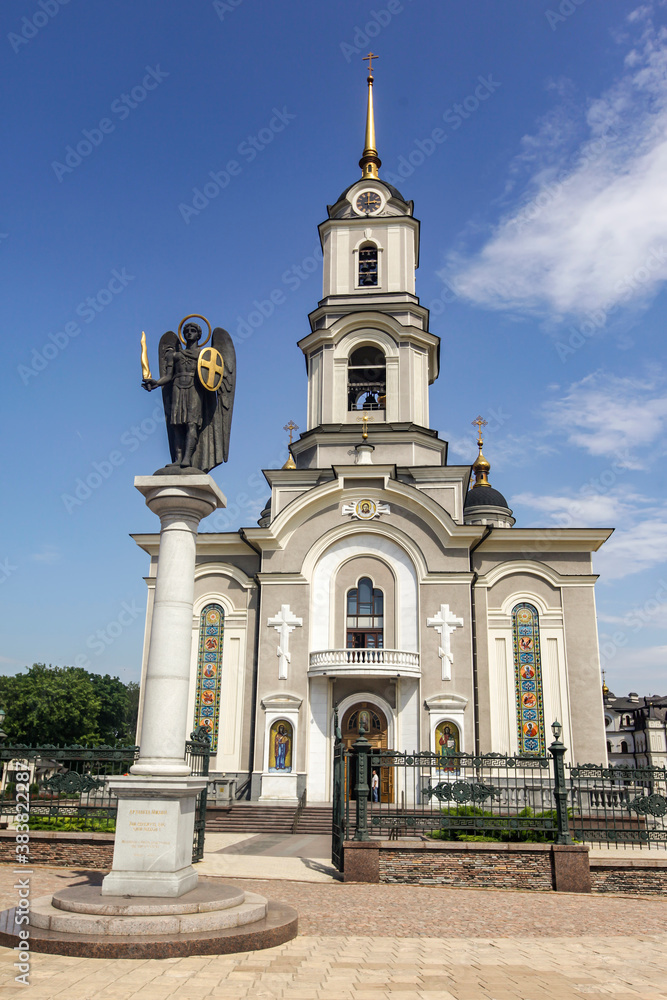 Obraz premium Statue of Saint Michael the Archangel near Orthodox Holy Transfiguration Cathedral in the center of Donetsk, Ukraine.
