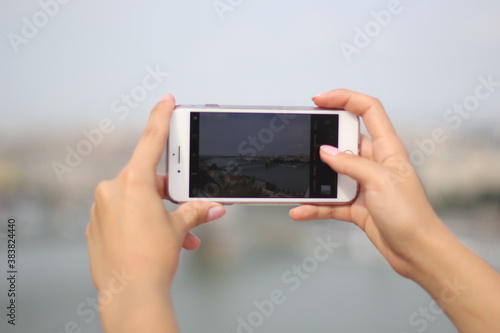 person taking photo with digital camera