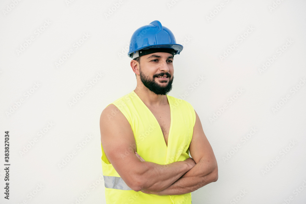 Posing construction worker posing with crossed arms happy