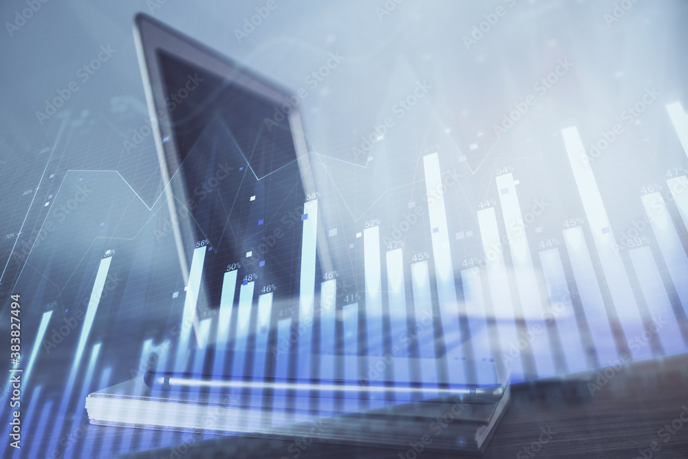 Forex Chart hologram on table with computer background. Double exposure. Concept of financial markets. Forex Chart hologram on table with computer background. Double exposure. Concept of financial markets.