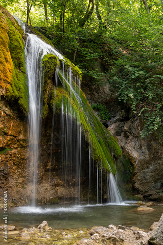 waterfall in the forest  rocky river  waterfall in the mountains