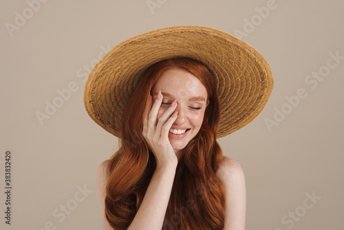 Ginger half-naked cheerful girl posing and laughing