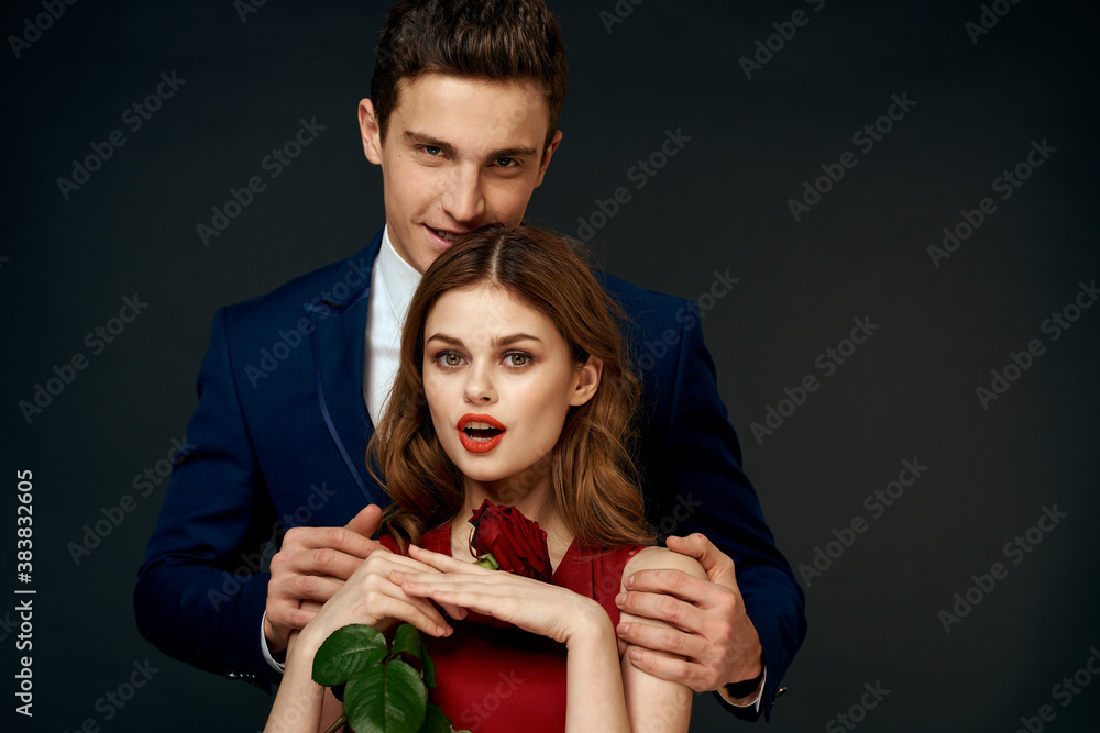 Beautiful couple charm hug lifestyle relationship rose luxury dark background Beautiful couple charm hug lifestyle relationship rose luxury dark background