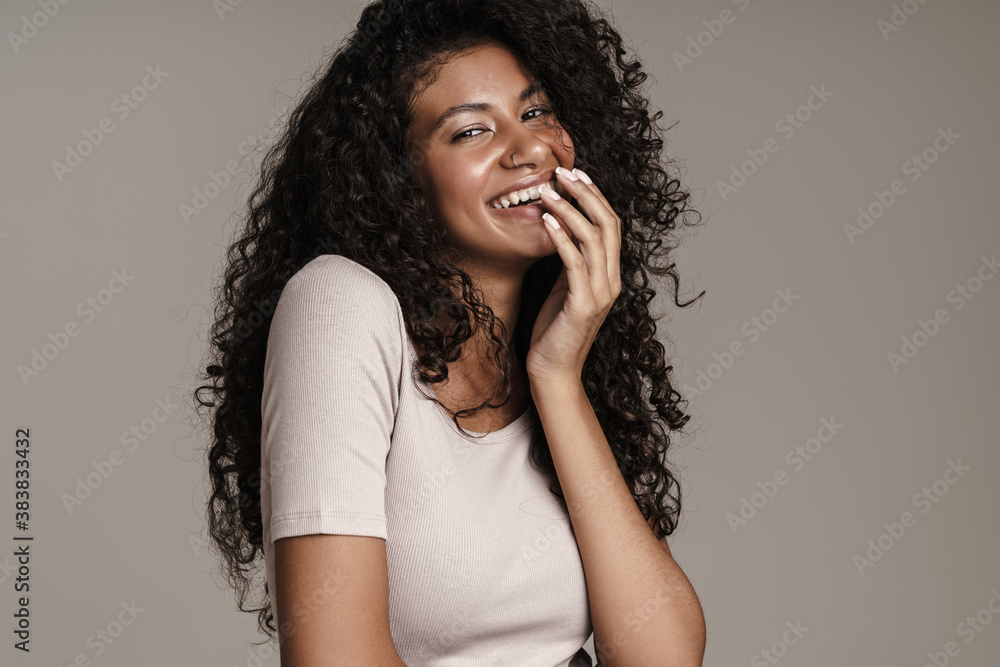 Cheerful dark-skinned girl standing isolated Cheerful dark-skinned girl standing isolated