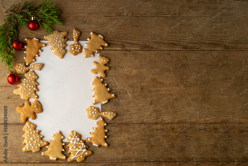 festive frame layout of New Year's christmas gingrerbread cookies on a red background. Merry Christmas and Happy New Year card festive frame layout of New Year's christmas gingrerbread cookies on a red background. Merry Christmas and Happy New Year card