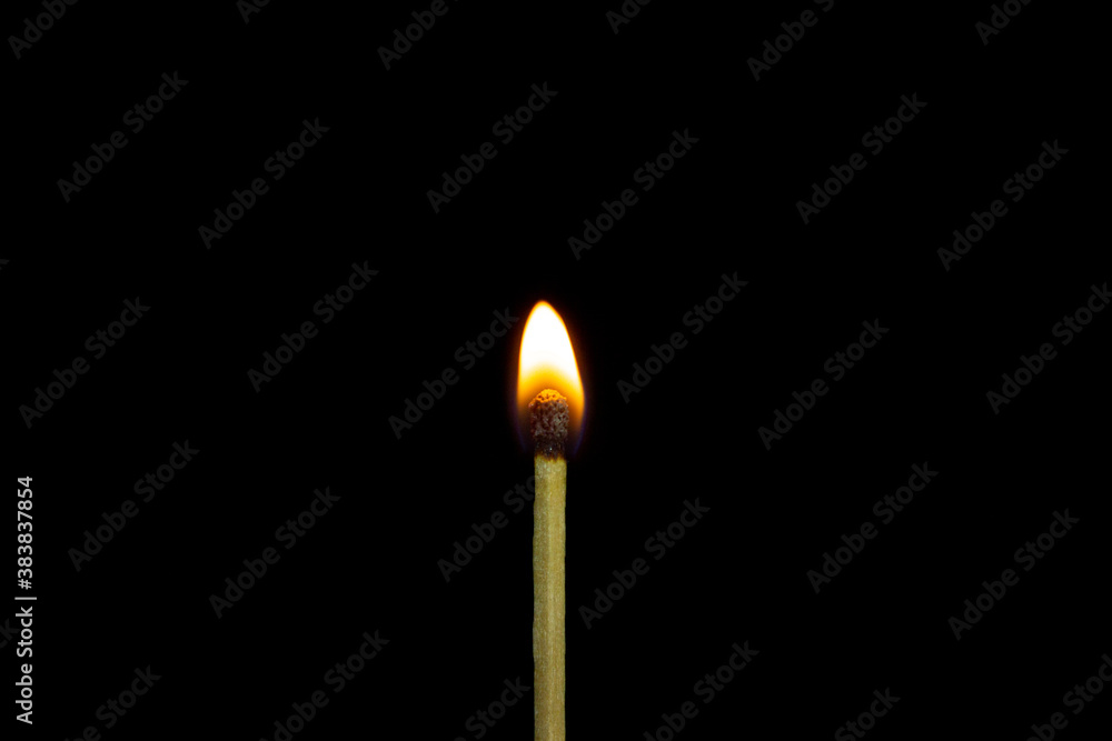 close up Single matchstick burning isolated on black background. close up Single matchstick burning isolated on black background.