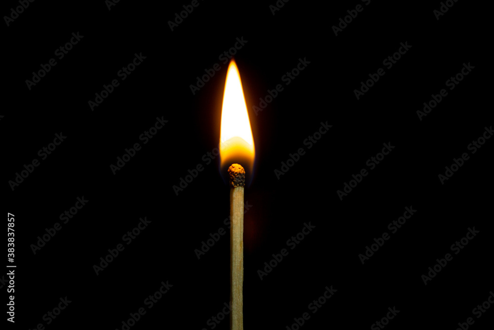 close up Single matchstick burning isolated on black background. close up Single matchstick burning isolated on black background.