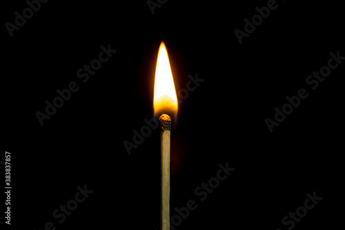 close up Single matchstick burning isolated on black background.