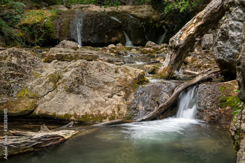 Mountain stream, mountain waterfall, waterfall in the forest, rocky river