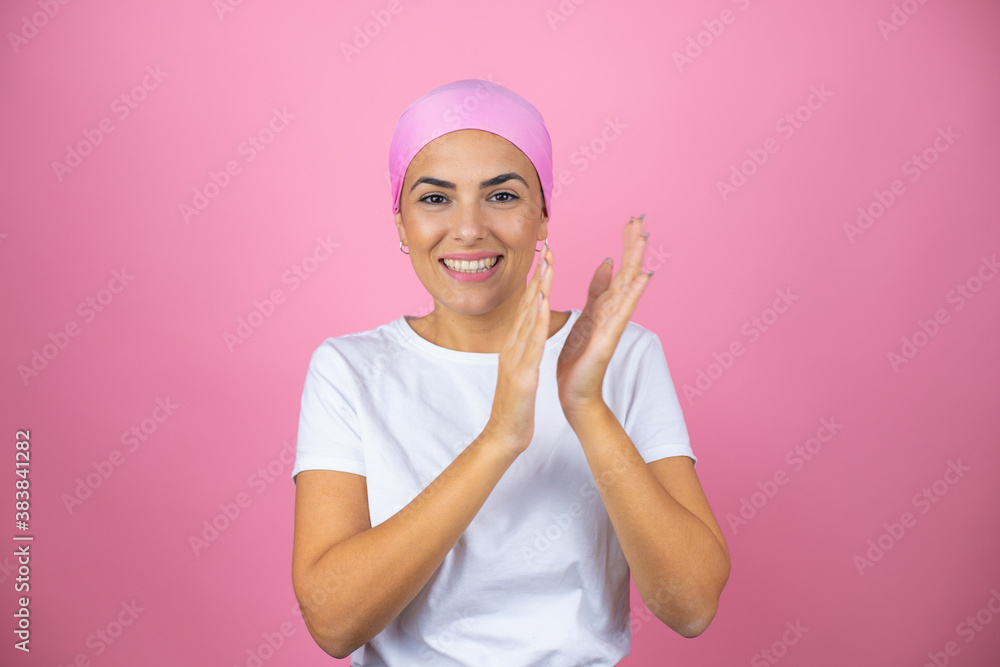 Young beautiful woman wearing pink headscarf over isolated pink background clapping and applauding happy and joyful, smiling proud hands together Young beautiful woman wearing pink headscarf over isolated pink background clapping and applauding happy and joyful, smiling proud hands together