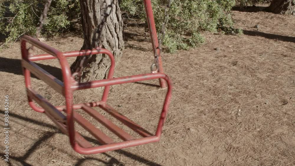Abandoned swings in a playground during the Covid-19 pandemic. Moody post apocalyptic vibes. Abandoned swings in a playground during the Covid-19 pandemic. Moody post apocalyptic vibes.