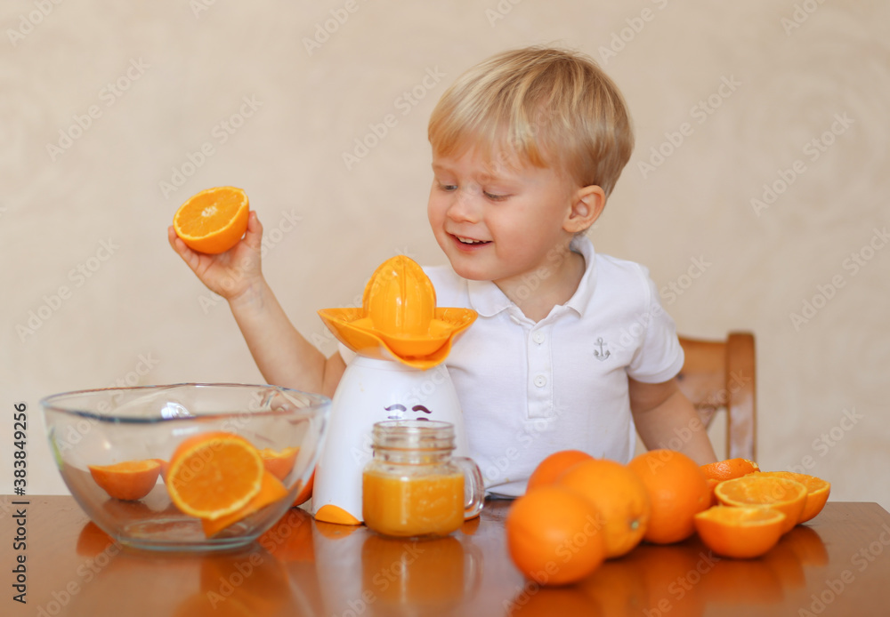 A child with fresh oranges and orange juice A child with fresh oranges and orange juice