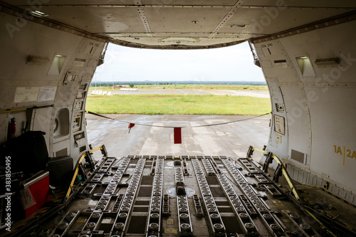 View of the big opening at the front of a Jumbo Jet freighter aircraft s main deck  after the nose cargo door has been opened completely