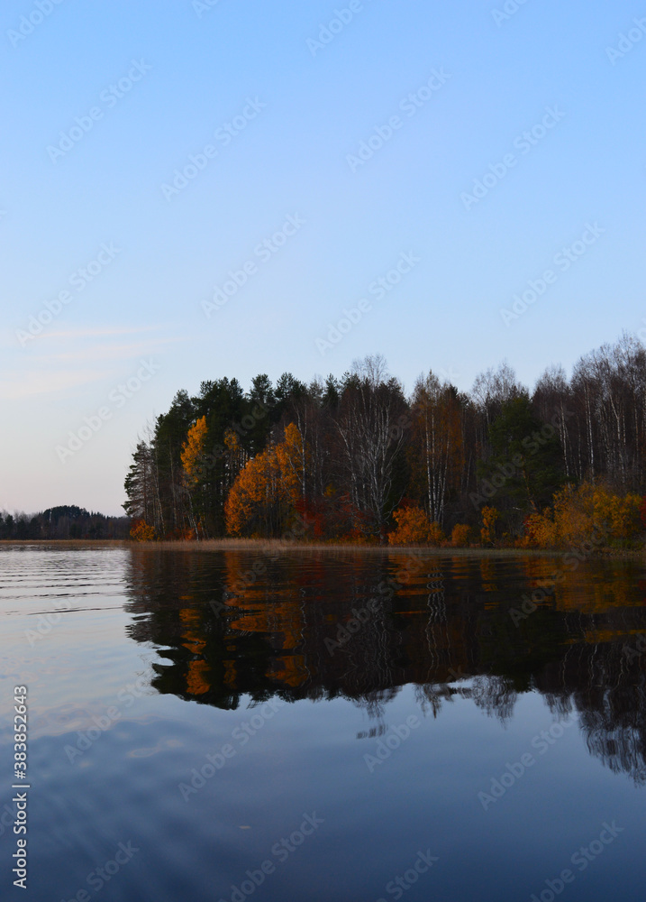 Autumn on the lake. Cool, clear water and little island with autumn colors. Autumn on the lake. Cool, clear water and little island with autumn colors.