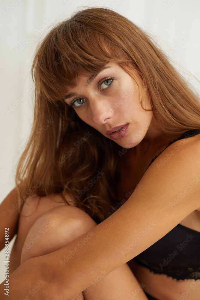 Young woman wearing a black lace bra Young woman wearing a black lace bra