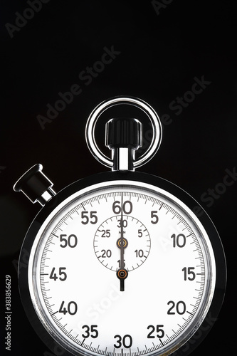 Konstfotografi Closeup of stopwatch over black background