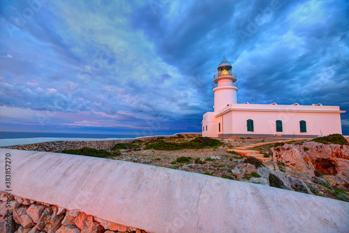 Menorca sunset at Faro de Caballeria Lighthouse photo