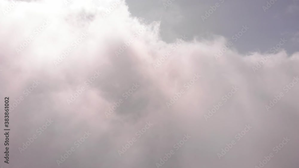 Flying a drone in the clouds in clear weather.