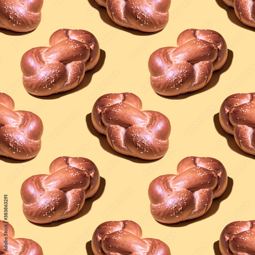 Seamless pattern with challah bread on yellow background. Minimal food pattern. Seamless pattern with challah bread on yellow background. Minimal food pattern.