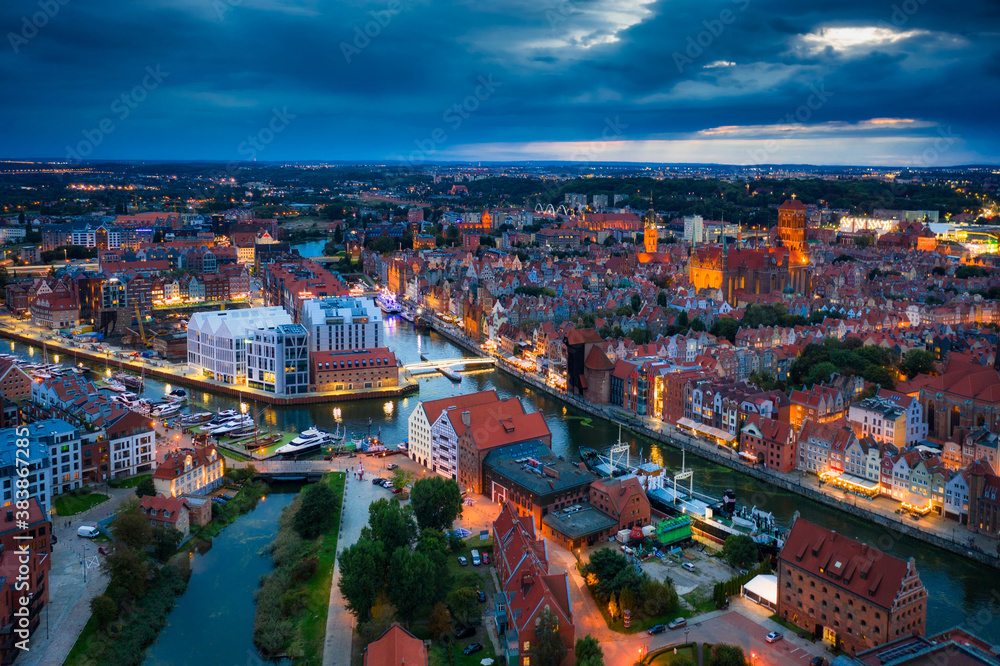 Aerial view of the Gdansk city over Motlawa river with amazing architecture at dusk,  Poland