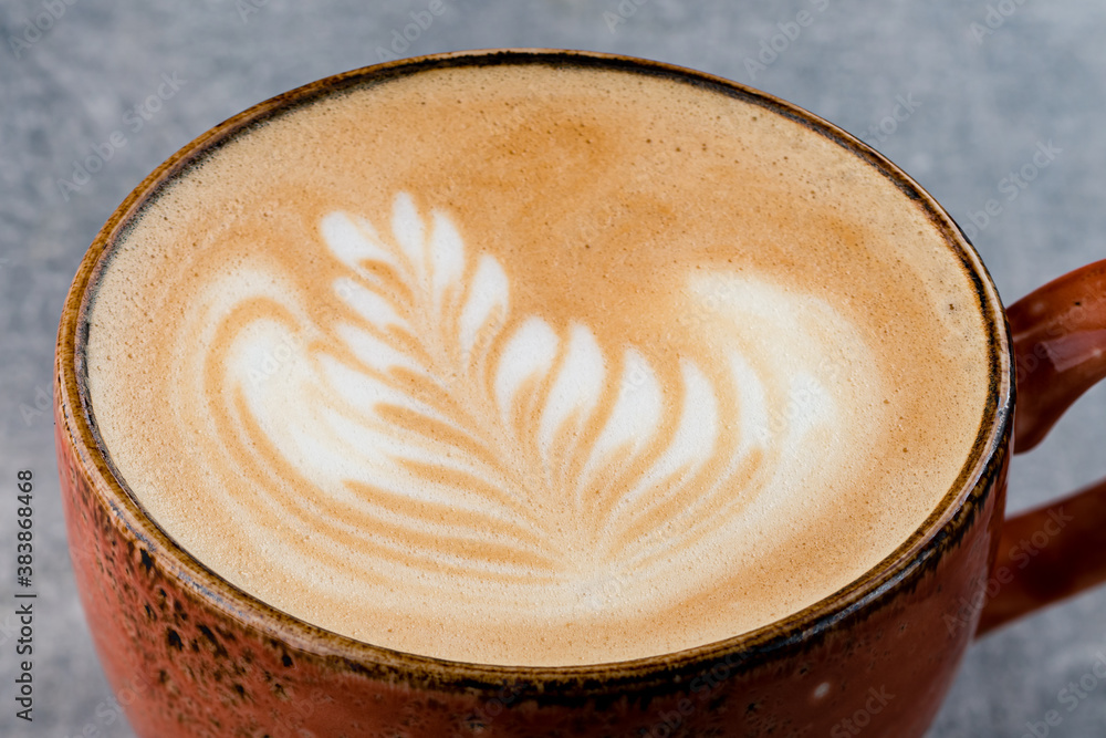 cappuccino with a drawing on the foam close-up cappuccino with a drawing on the foam close-up
