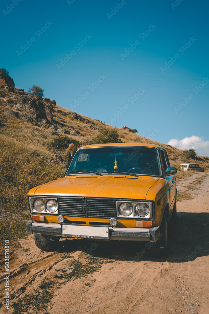 Old yellow retro car in Armenia