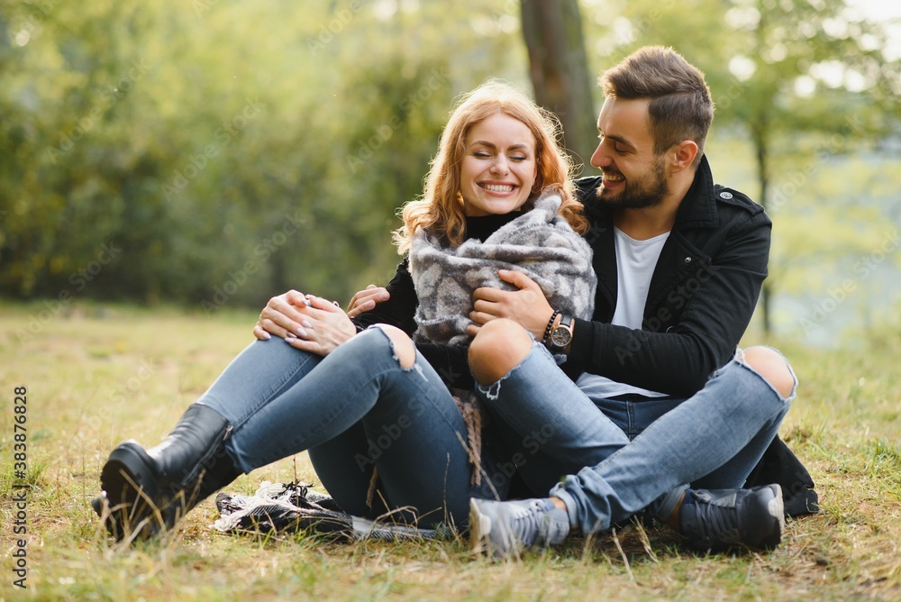 gentle and stylish couple are having a walk in the autumn park gentle and stylish couple are having a walk in the autumn park