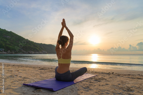Woman practices yoga.