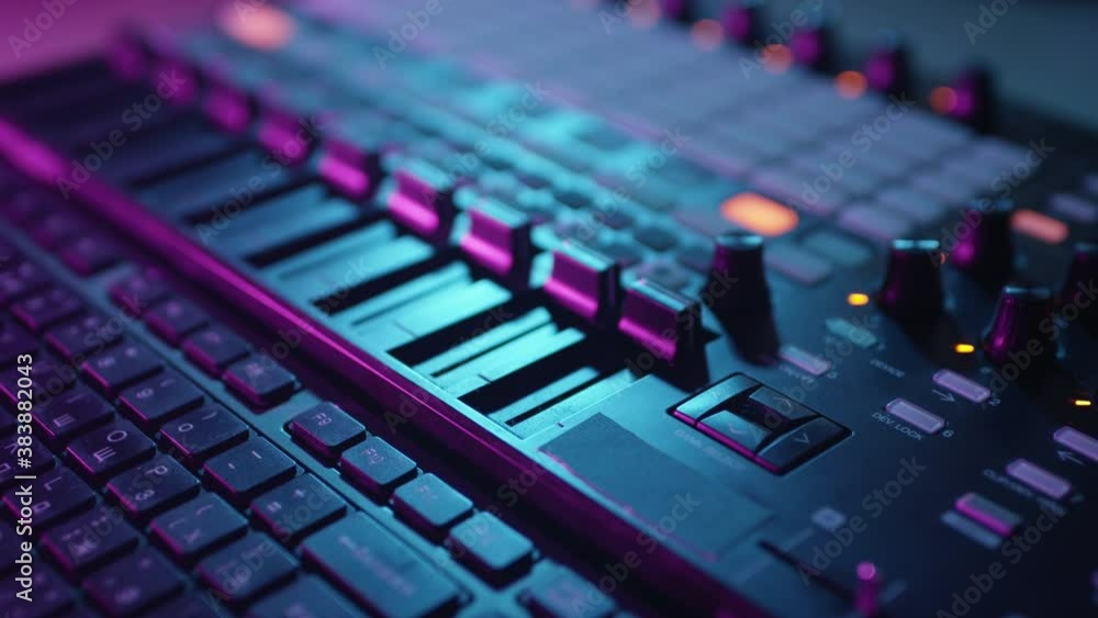 Close-up of fingers of a hand. Leveling Sound On A Recorder. A professional DJ or producer turns up the volume of music in the studio on a mixing console. The artist makes creativity. Records a track