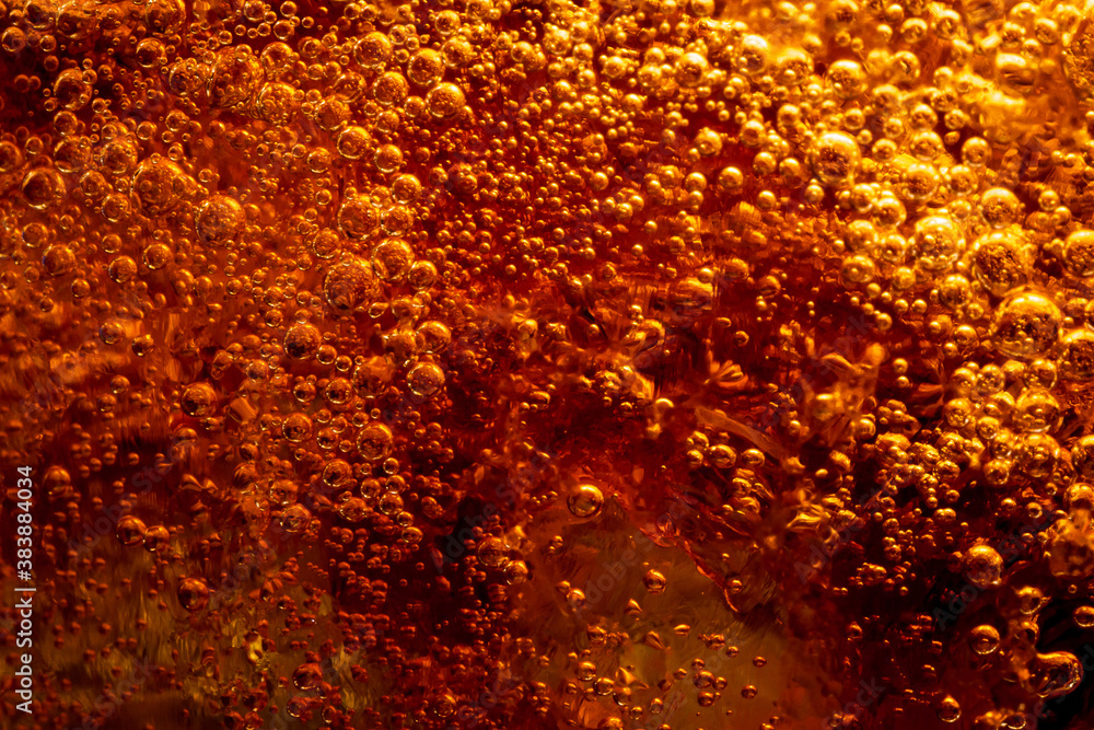 Close up view of the ice cubes in cola background ,Detail of Cold Bubbly Carbonated Soft Drink with Ice 